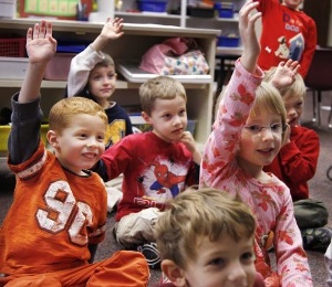 first graders raising hands
